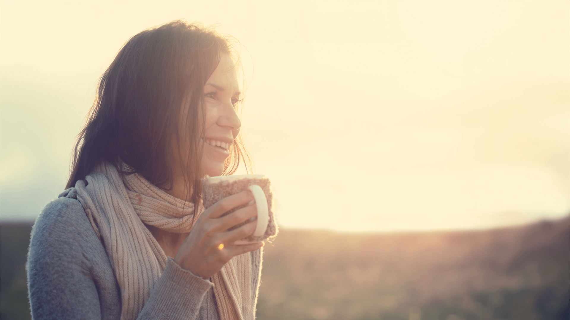 Woman Drinking Coffee Watching Sunset